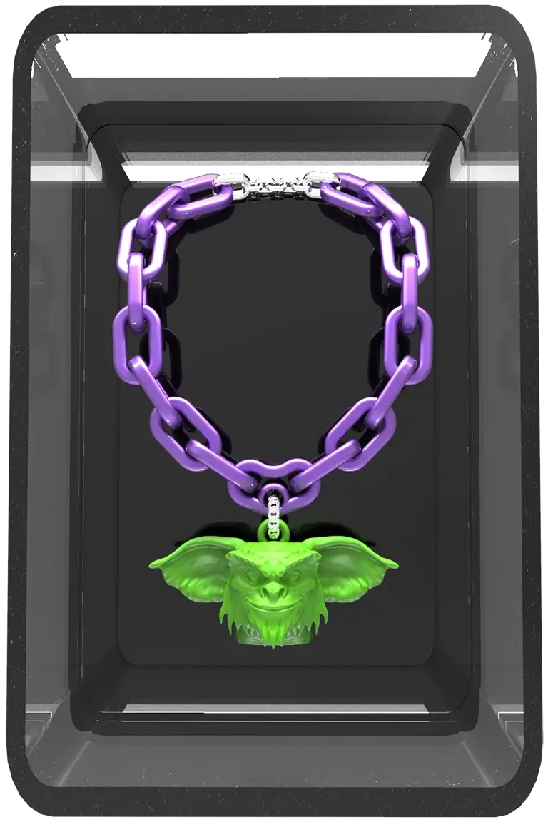 Dark 3D box containing the green Mogwai pendant and its purple chain